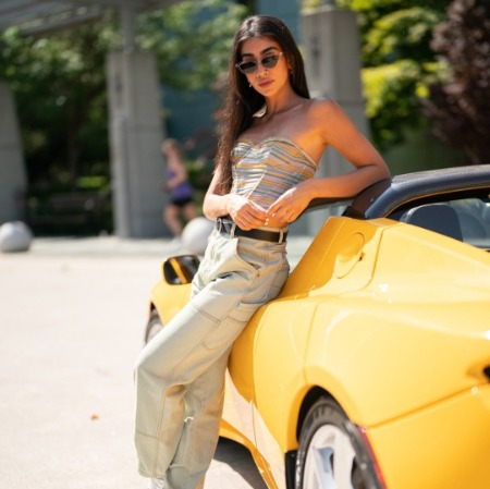 Rhianna Jagpal posing with the car. 